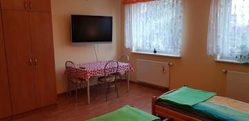 Фото номера Двухместный номер с 2 отдельными кроватями и дополнительной кроватью Хостелы Wynajem Pokoi Barka Zdzisław Barbużyński г. Orunia 6
